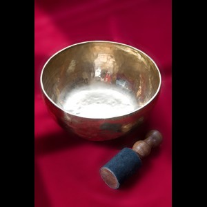 Singing bowl with wood stick and leather